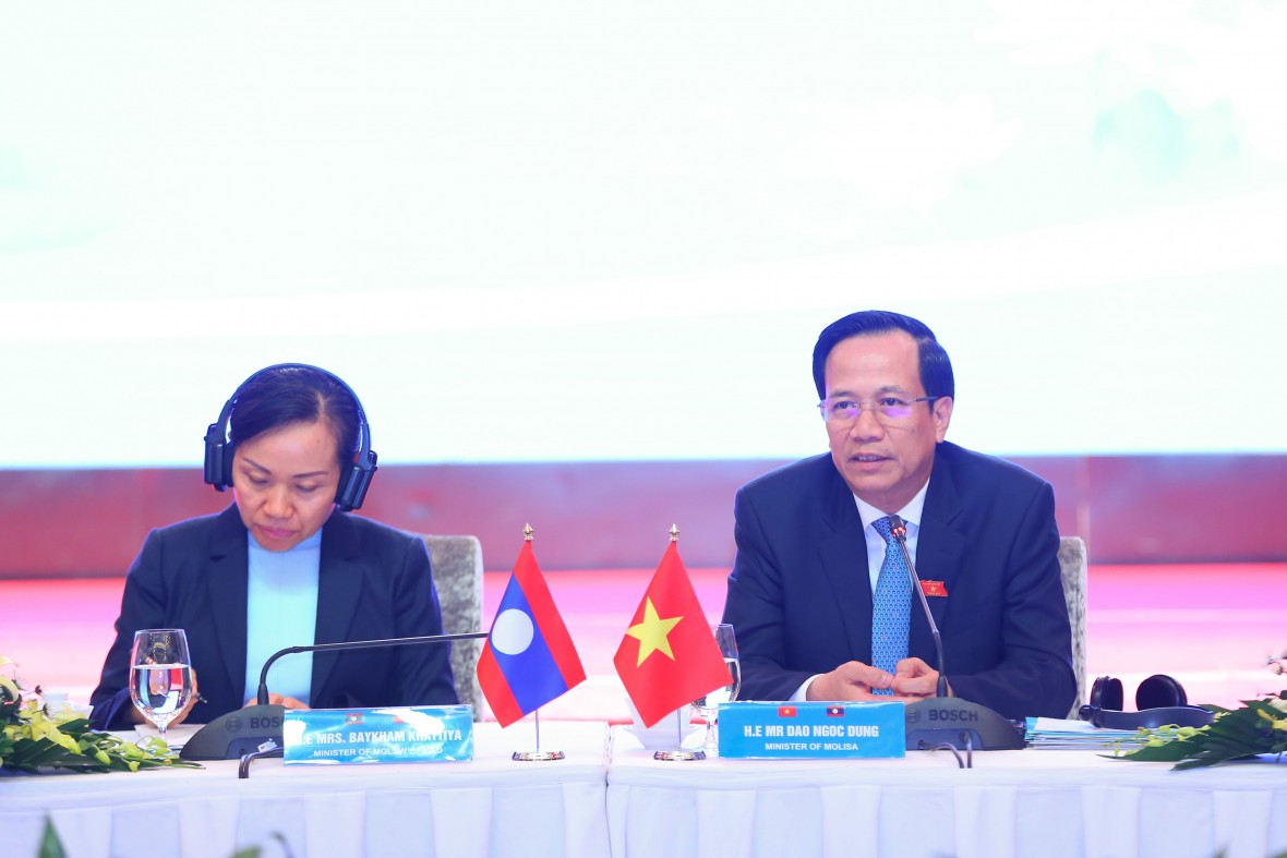 Bộ trưởng LĐ-TB&XH Việt Nam Đào Ngọc Dung và bà Baykham Khattiya Bộ trưởng Bộ LĐPLXH Lào đồng chủ trì Hội nghị (Ảnh: Nguyễn Sơn).